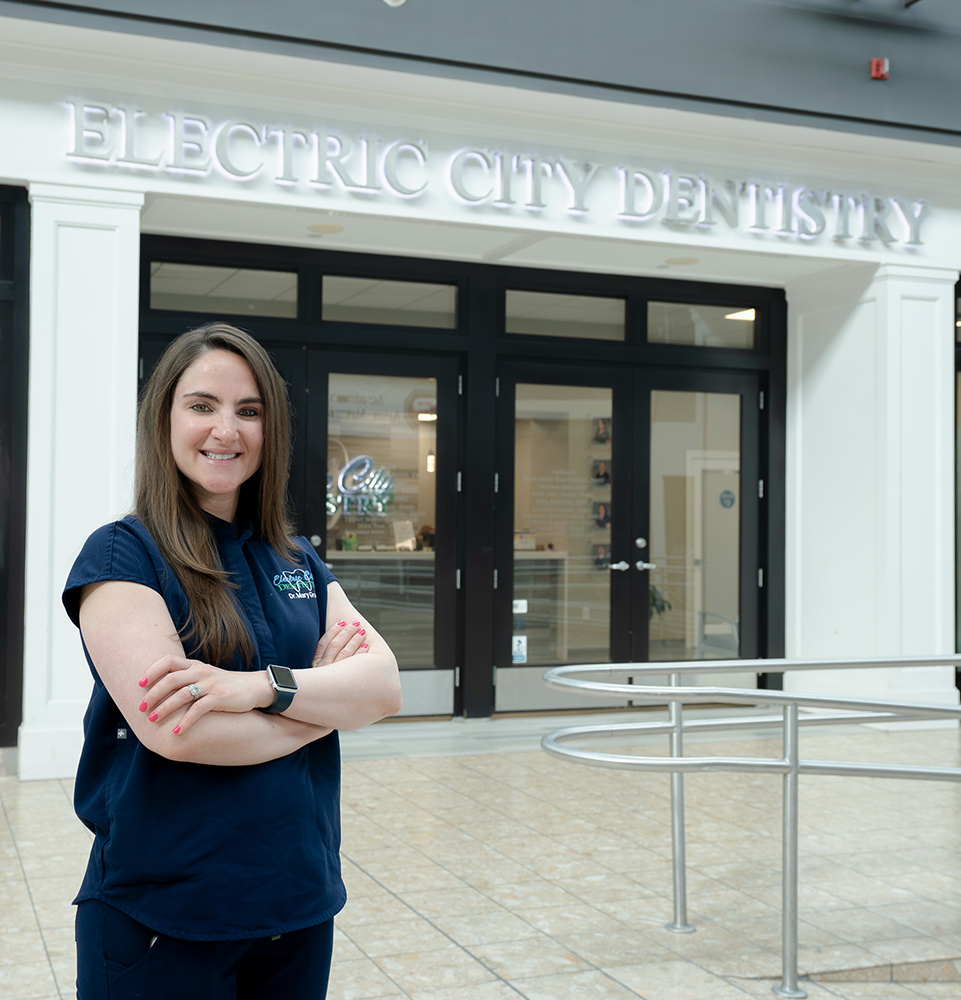 Meet Dr. Rizzo! Standing outside of Electric City Dentistry